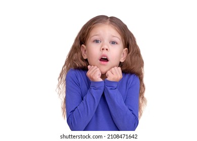 Scared Child Kid Or Shocked Due To News Holding Raised Fists Close To Face, Isolated On White Background Looking At Camera Waist Up Caucasian Little Girl Of 5 Years In Blue