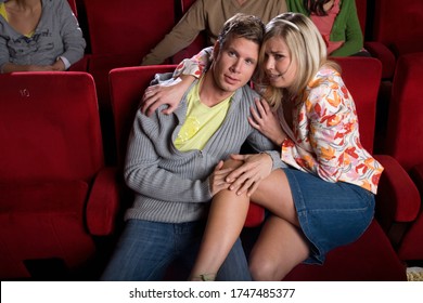 Scared Couple In Movie Theater