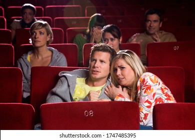 Scared Couple In Movie Theater