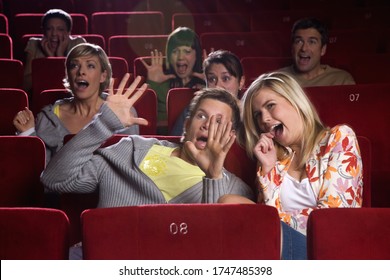 Scared Couple In Movie Theater