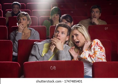 Scared Couple In Movie Theater