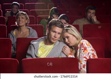 Scared Couple In Movie Theater