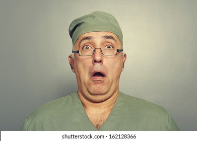 Scared Doctor In Glasses Looking At Camera