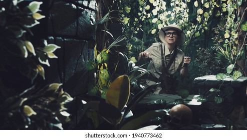 Scared Explorer Finding Ancient Ruins In The Forest, She Is Holding A Machete And Walking