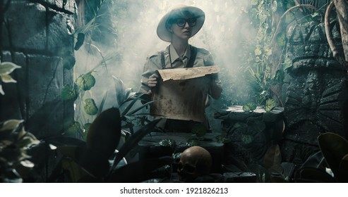 Scared explorer lost in the jungle: she is holding a map and looking at some ancient ruins - Powered by Shutterstock