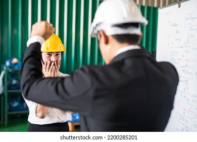 Scared Female Worker Blame And Shout By Her Bossy Manager For Manufacturing Plan Delay. Depress, Stress, Anxious, Serious In Working Industry, Unemployed, Fired, And Lay Off Concept.