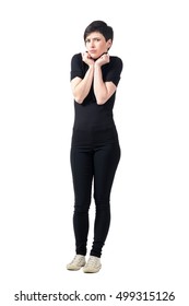 Scared Freezing Cold Woman In Turtle Neck T-shirt Posing At Camera. Full Body Length Portrait Isolated Over White Studio Background.