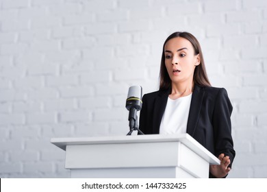 Scared Lecturer Suffering From Fear Of Public Speaking While Standing On Podium Tribune