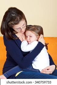 Scared Little Girl Hugging Her Mother