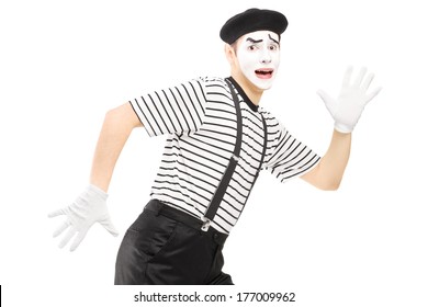 Scared Male Mime Artist Running Away Isolated Against White Background