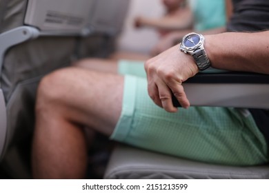 Scared man strongly grab armrest in plane - Shutterstock ID 2151213599