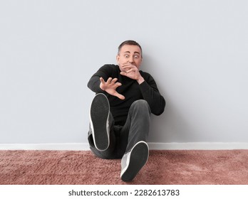 Scared mature man near light wall - Shutterstock ID 2282613783