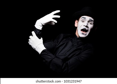 Scared Mime With Hand Monster Looking At Camera Isolated On Black