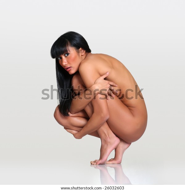 Nude girl squats