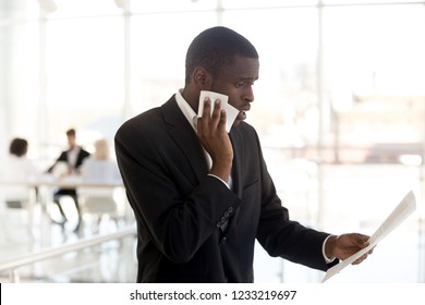 Scared Nervous African American Businessman Sweating Wiping Face Feeling Stressed Afraid Waiting For Job Interview, Worried Black Male Speaker Reading Paper Preparing For Public Speaking Fear Concept