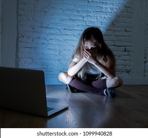 Scared Sad Girl Bullied On Line With Laptop Suffering Cyberbullying And Harassment Feeling Desperate And Intimidated. Child Victim Of Bullying Stalker Social Media Network