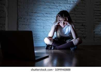 Scared Sad Girl Bullied On Line With Laptop Suffering Cyberbullying And Harassment Feeling Desperate And Intimidated. Child Victim Of Bullying Stalker Social Media Network