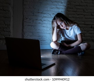 Scared Sad Girl Bullied On Line With Laptop Suffering Cyberbullying And Harassment Feeling Desperate And Intimidated. Child Victim Of Bullying Stalker Social Media Network