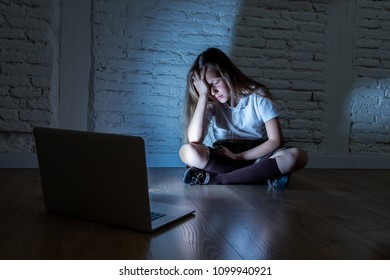 Scared Sad Girl Bullied On Line With Laptop Suffering Cyberbullying And Harassment Feeling Desperate And Intimidated. Child Victim Of Bullying Stalker Social Media Network