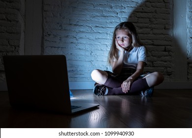 Scared Sad Girl Bullied On Line With Laptop Suffering Cyberbullying And Harassment Feeling Desperate And Intimidated. Child Victim Of Bullying Stalker Social Media Network