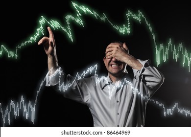 Scared Trader Pointing To Stock Market Charts With Eyes Closed. Uncertainty Concept Photo.