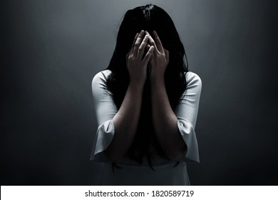 Scared Woman On Dark Background