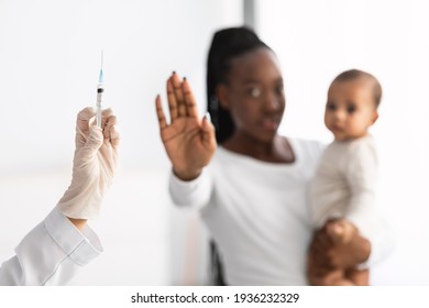 Scared Young African American Showing Stop Gesture To Syringe