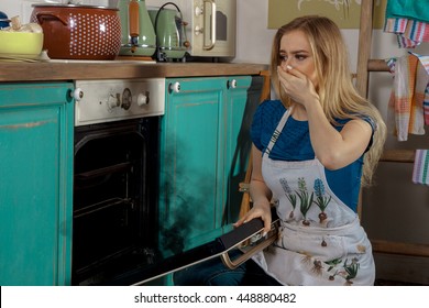 Scared Young Blonde In The Kitchen With Burned Food