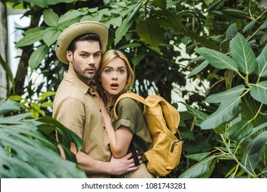 Scared Young Couple In Safari Suits In Jungle