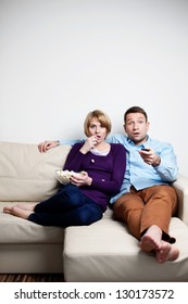 Scared Young Couple Watching Tv