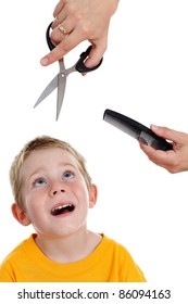 Scared Young Kid Looking Up To Hands Holding Scissors And Comb