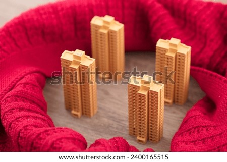 The scarf surrounds the commercial housing model for heating