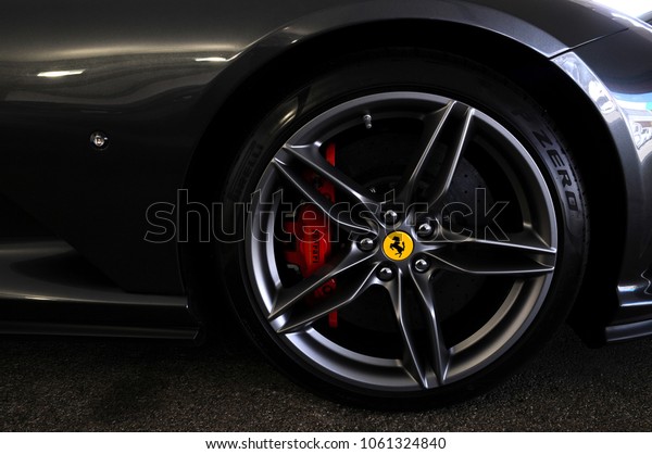 Scarperia (Florence), Italy - March 2018 :\
Close-up of a wheel of a Ferrari sports car in the Mugello Paddock.\
Ferrari S.P.A. is an Italian luxury sports car manufacturer,\
founded by Enzo\
Ferrari.