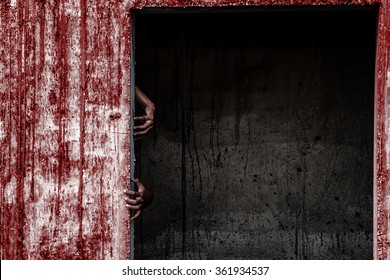 scary abandoned building with blood wall and ghost hand coming out of a door