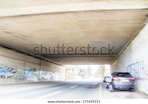 Scary blurres tunnel with\
car