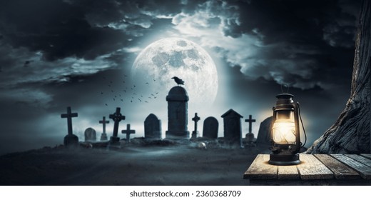 Scary cemetery with ancient graves and old lit lantern in the foreground - Shutterstock ID 2360368709