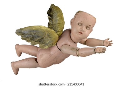 Scary creepy doll with old vintage Halloween trick or treat angel ghoul baby wings isolated on white.