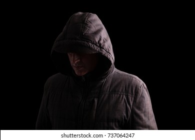 scary man in black hoodie