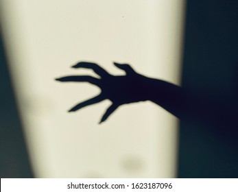 Scary Hand Shadow On Wall Background