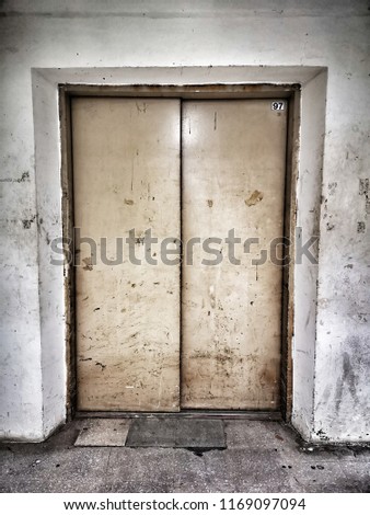 Scary and horror scene - Grunge and Rustic of old elevator door in abandoned building    