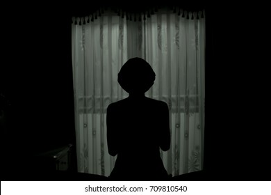 Scary Human Body Silhouette Woman Front Of Window Behind The Black Curtain.