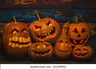 Scary Jack O Lantern halloween pumpkins in darkness