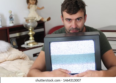 Scary Looking Man Holding Vintage Tv Monitor 