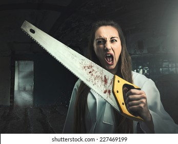Scary portrait of an angry woman with a saw
