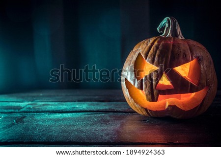 A scary pumpkin lantern with evil grin for Halloween.