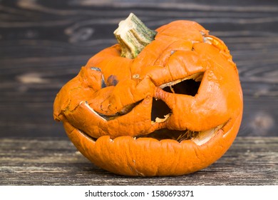 Scary Pumpkins Of Which Are Preparing Lamps To Celebrate Halloween In The Autumn Season, Homemade Products Made Roughly And Not Neatly, The Pumpkin Began To Rot And Decay