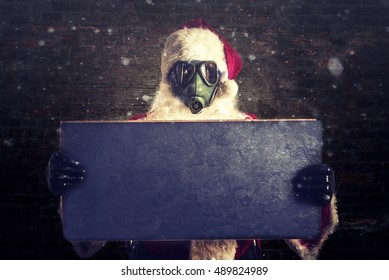 Scary Santa Claus Holding Blank Chalkboard For Ads 