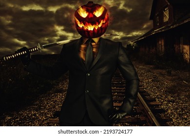 Scary smiling jack-o-lantern character in suit with katana on shoulder. Abandoned train station in background. - Shutterstock ID 2193724177