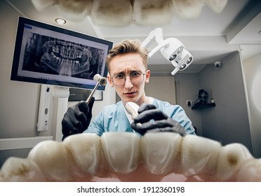 Scary Things. Doctor Looking Into Mouth, Checking, Examining Teeth. Using Professional Tools And Equipments. Healthcare And Medicine, Stomatology, Feelings Of Patient. Look From Inside The Teeth.