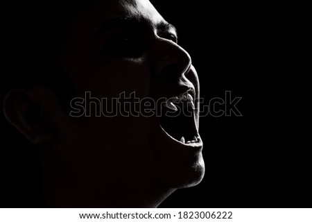 Scary vampire man on dark background